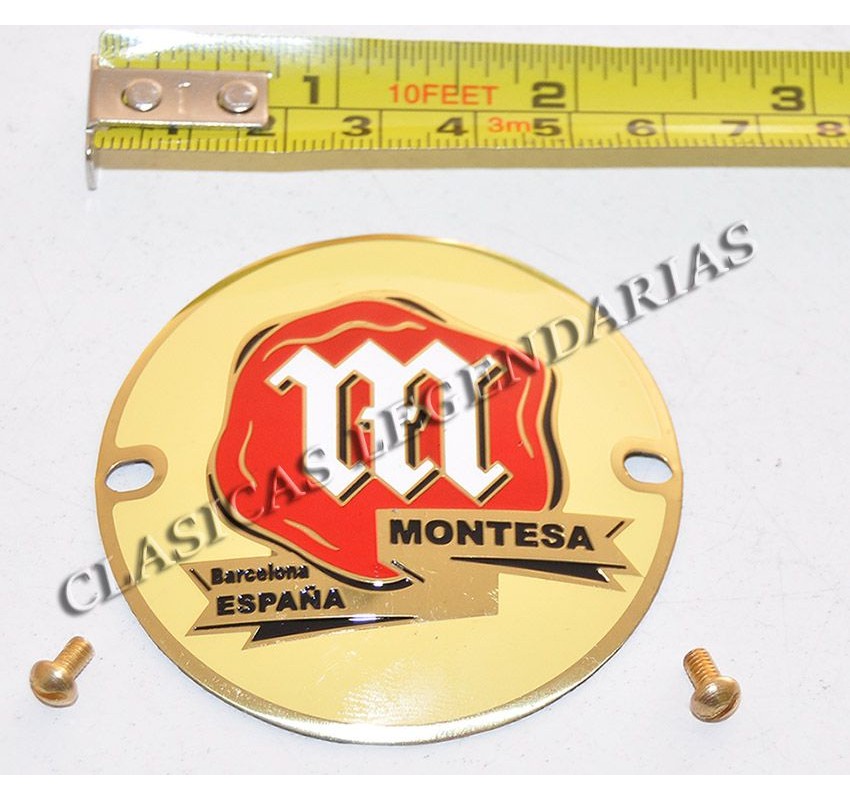 Montesa Impala screwed metal anagram, includes gold screws for mounting in deposit